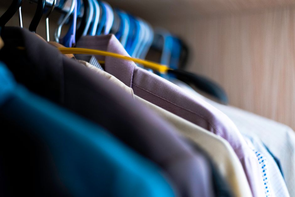 Organized clothes in a luxury walk-in wardrobe